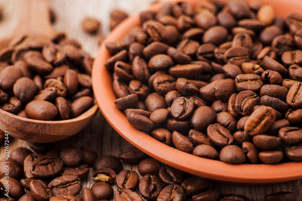 Fototapeta premium Coffee beans on textured surfaces