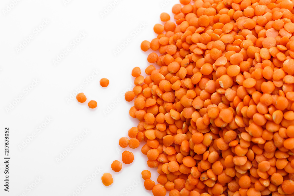 raw lentils on a white acrylic background raw lentils on a white acrylic background