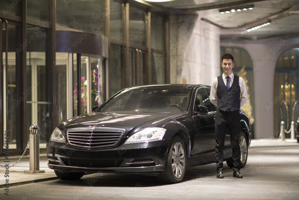 Chauffeur standing next to the car Chauffeur standing next to the car