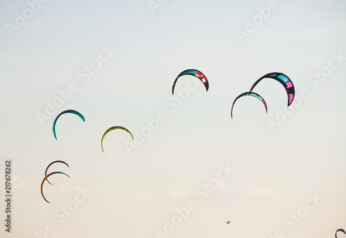 Kite surfing by the sea in sunny weather