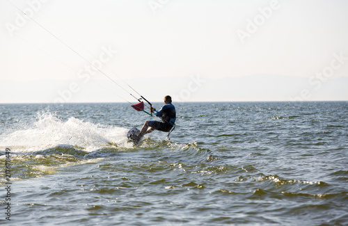 Kite surfing by the sea in sunny weather © caxa75onohoi