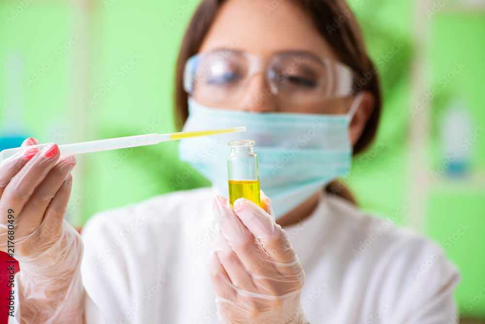 Beautiful female biotechnology scientist chemist working in lab Beautiful female biotechnology scientist chemist working in lab