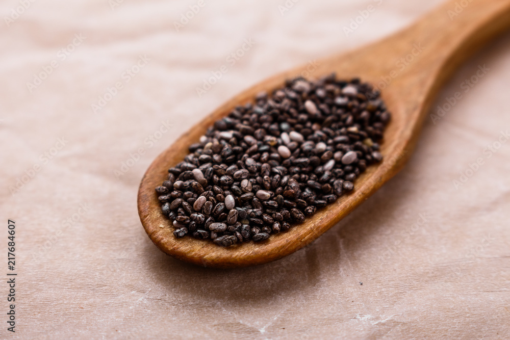 chia seeds on a light rustic background chia seeds on a light rustic background