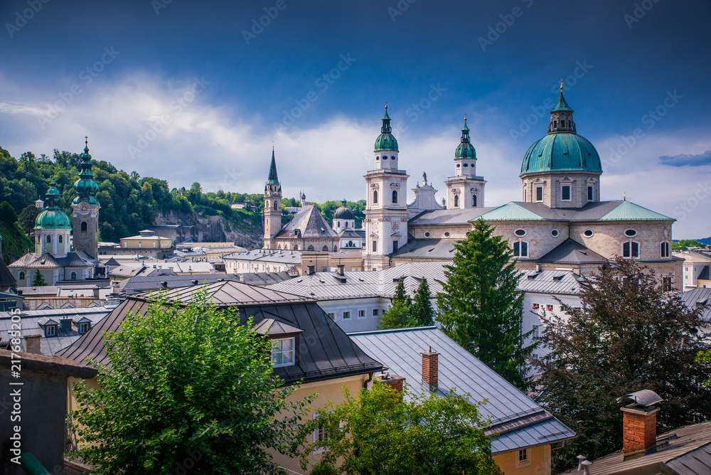 Classic panoramic view of the historic city of Salzburg with famous Salzburg Cathedral in beautiful summer light