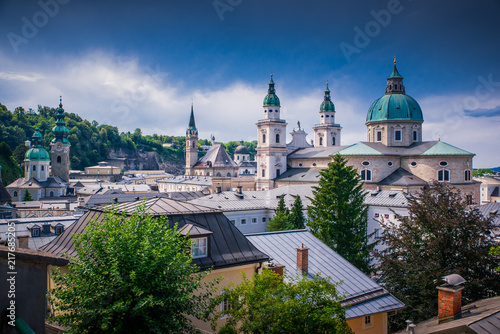 Classic panoramic view of the historic city of Salzburg with famous Salzburg Cathedral in beautiful summer light