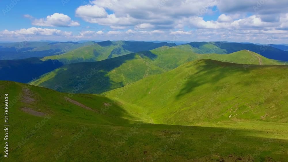 Aerial shot of two mountains looking like legs of a giant in the Carpathians in summer Aerial shot of two mountains looking like legs of a giant in the Carpathians in summer
