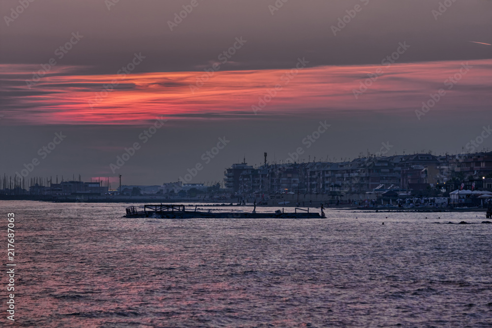 Beautiful colorful scenic sunset on the sea of Rome in Lido di Ostia - Italy