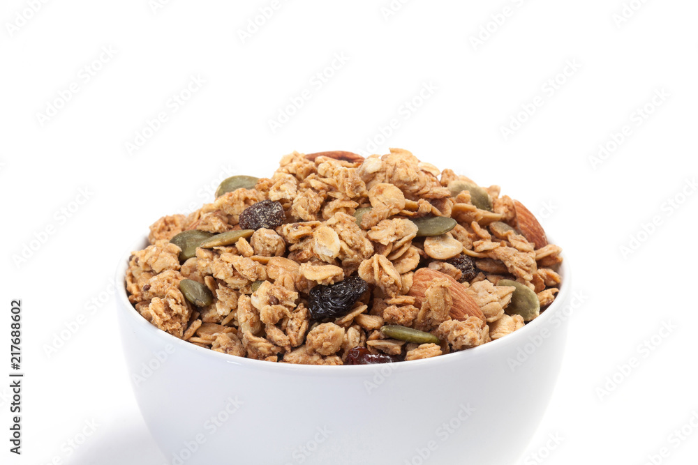Close up Granola on white bowl isolated on white background. Close up Granola on white bowl isolated on white background.