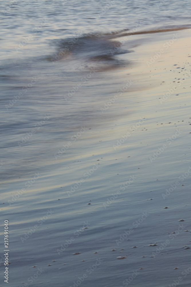 Beautiful sunset reflected on italian sea waves