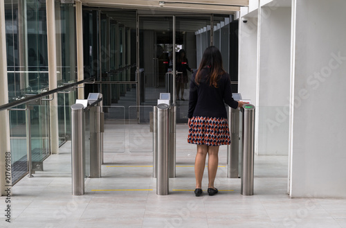 women walking to entrance gate security with key card access control smart office building