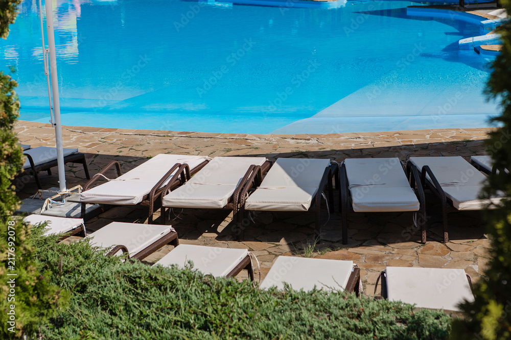 Fototapeta premium Summer vacation by the pool with an inflatable toy