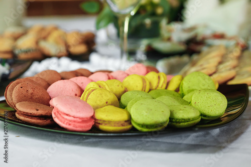 Macaroons in a vase and peonies photo