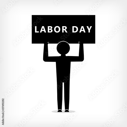A man with a poster with the inscription Labor Day,