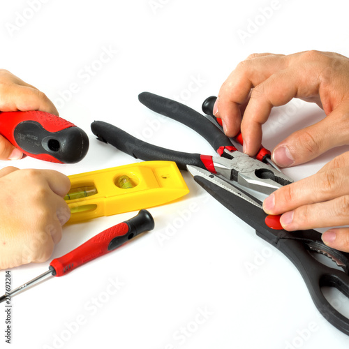 Wallpaper Mural Hands with variery of working tools for construction and repairing. White background. Vintage style Torontodigital.ca