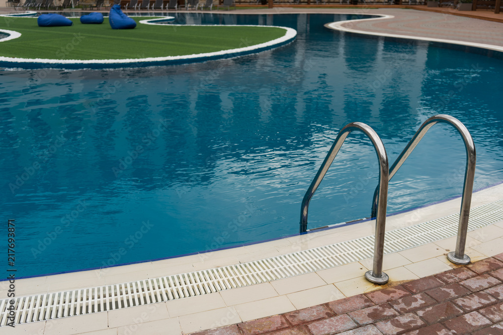 stainless steel ladder and swimming pool