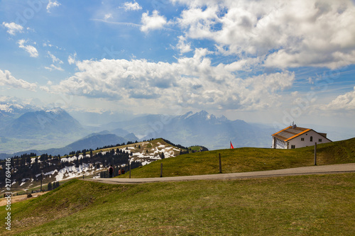 Green grass field on top of Rigi Kulm Luzern Switzerland with Alps snow mountain view a