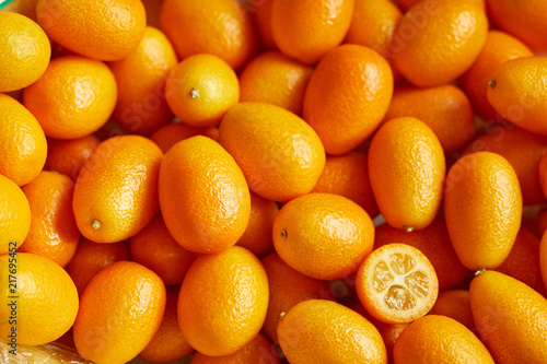 Bunch of fresh kumquats in the organic food market