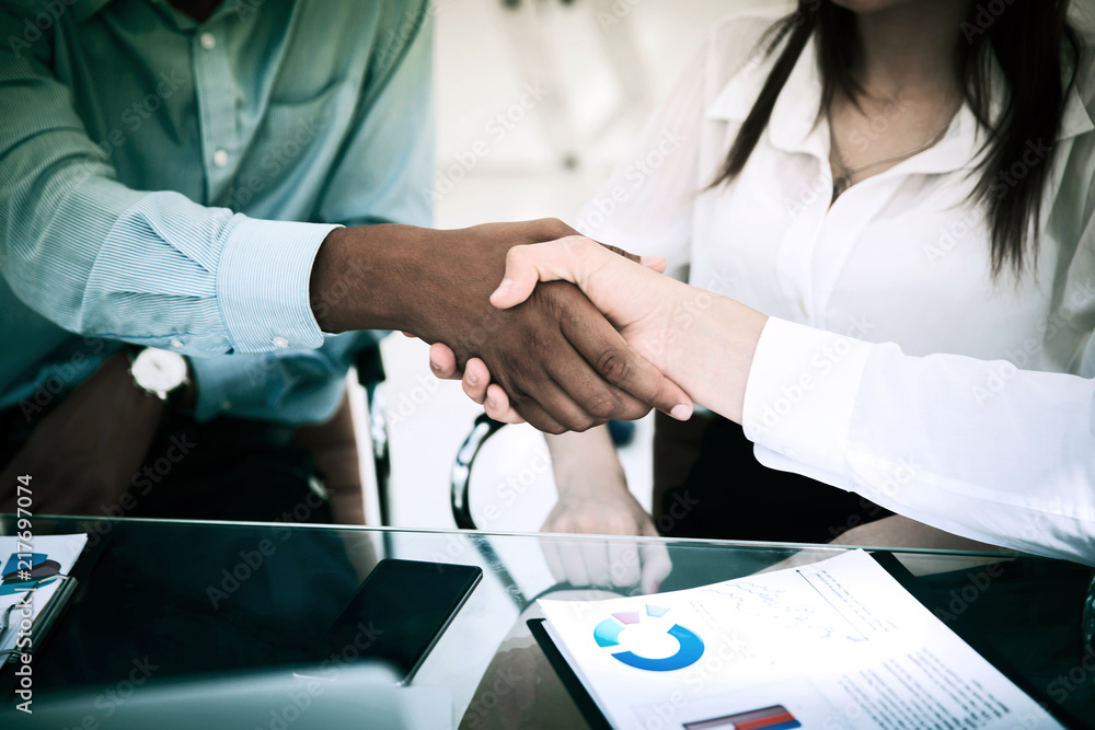 closeup.the financial partners shaking hands over a Desk. closeup.the financial partners shaking hands over a Desk.