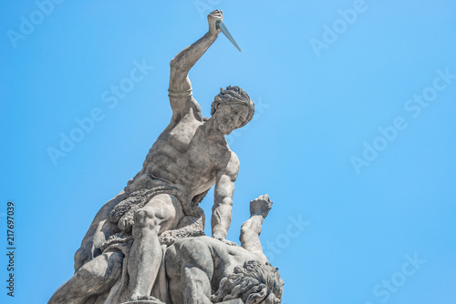 Statue of Battling Titan with a dagger at the main Gate of Hradcany Castle in Prague, Czech Republic © neurobite
