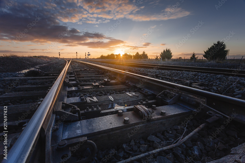 Sunset Over Railway Tracks, Low Perspective with Detail View of Scene.