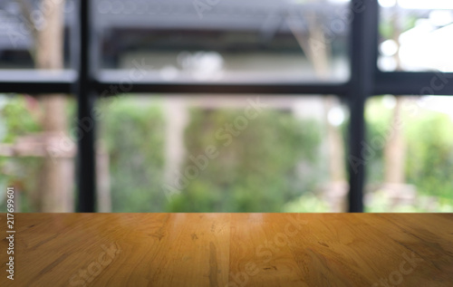 Empty dark wooden table in front of abstract blurred bokeh background of restaurant . can be used for display or montage your products.Mock up for space. © Charlie's