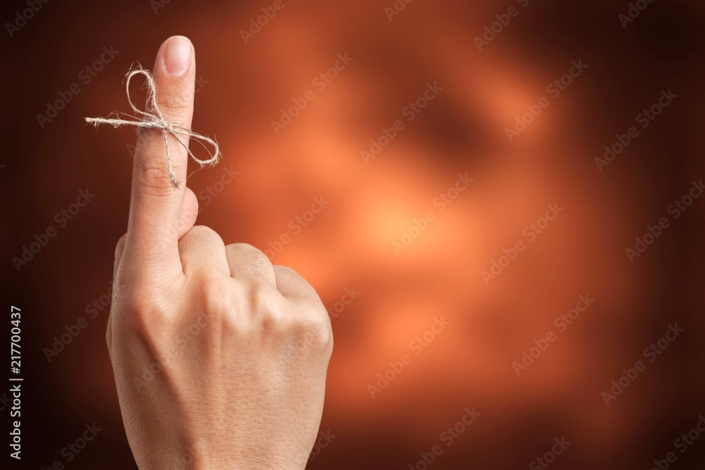 Rope bow on finger pointing up on - obrazy, fototapety, plakaty 