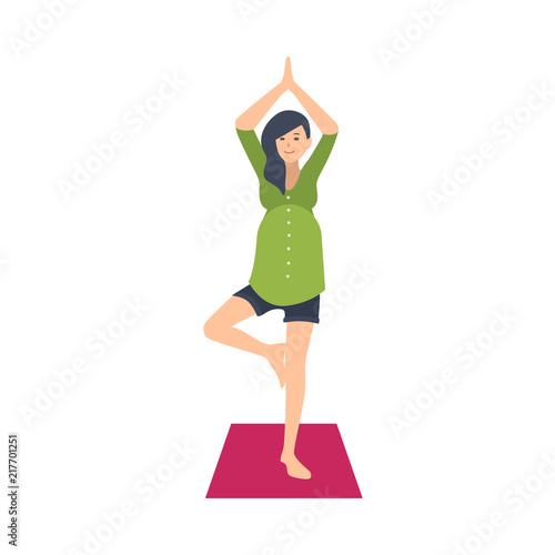 Cute pregnant woman practicing yoga exercise