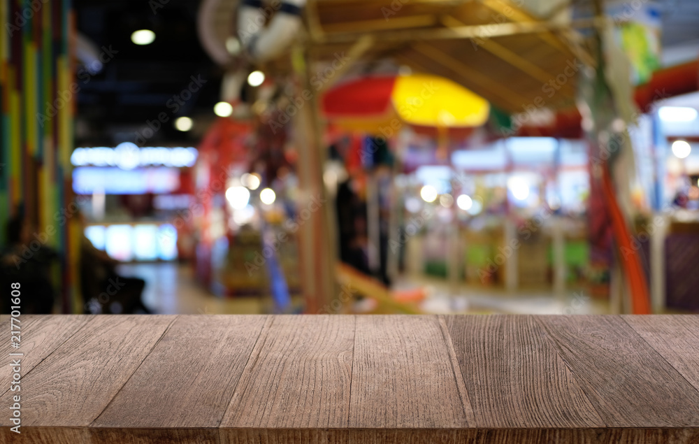 Empty dark wooden table in front of abstract blurred bokeh background of restaurant . can be used for display or montage your products.Mock up for space. Empty dark wooden table in front of abstract blurred bokeh background of restaurant . can be used for display or montage your products.Mock up for space.