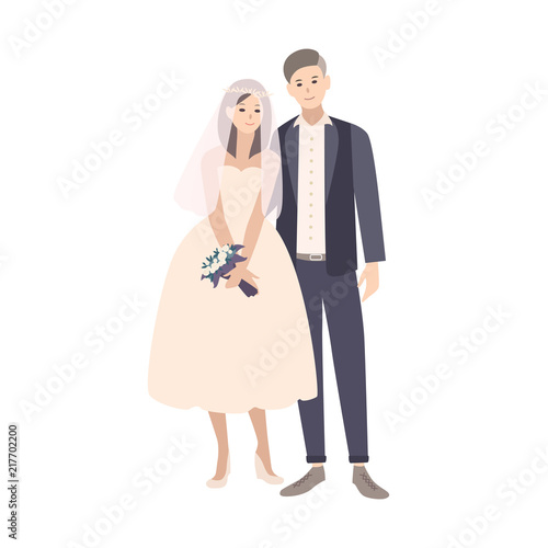 Cute pair of young fashionable bride and groom dressed in fancy clothing