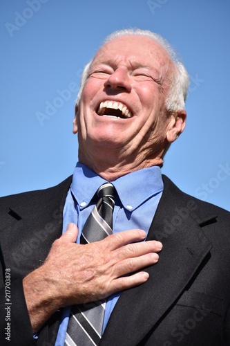 Business Man And Laughter Wearing Suit And Tie Isolated