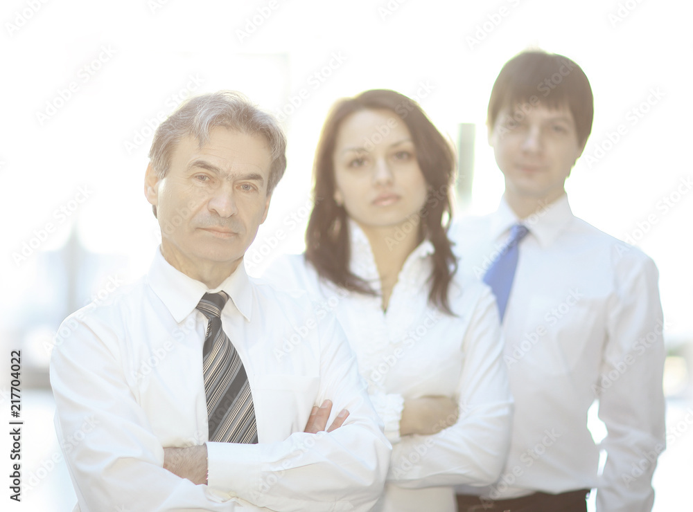 confident business team in the background of the office confident business team in the background of the office