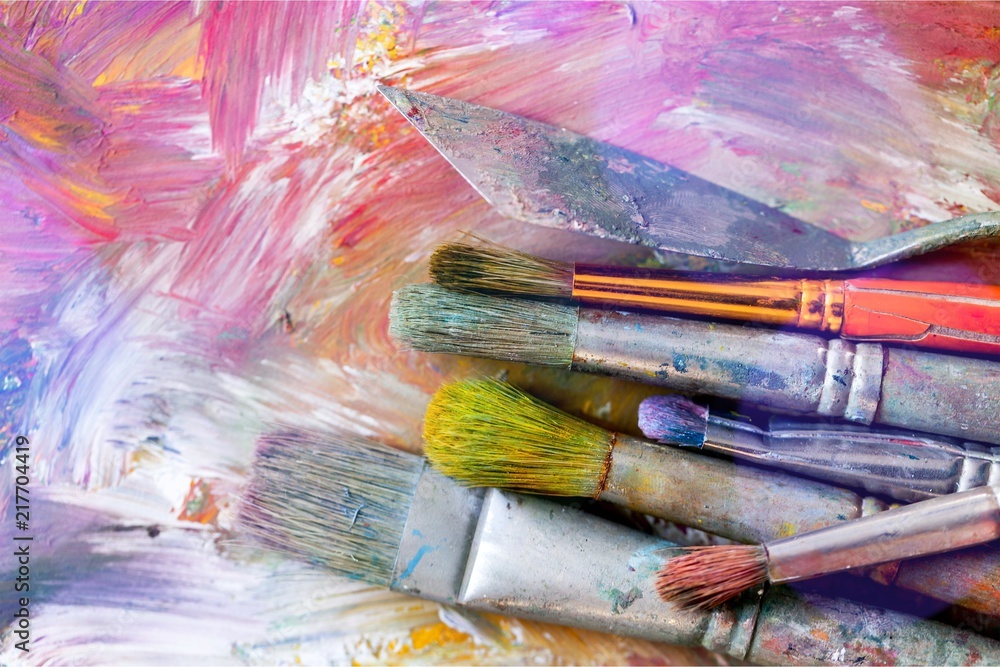 Artist paint brushes and paint cans of Artist paint brushes and paint cans of
