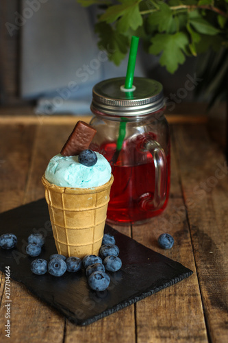 ice cream with blueberries (blue ice cream). food background. Top view with copy space