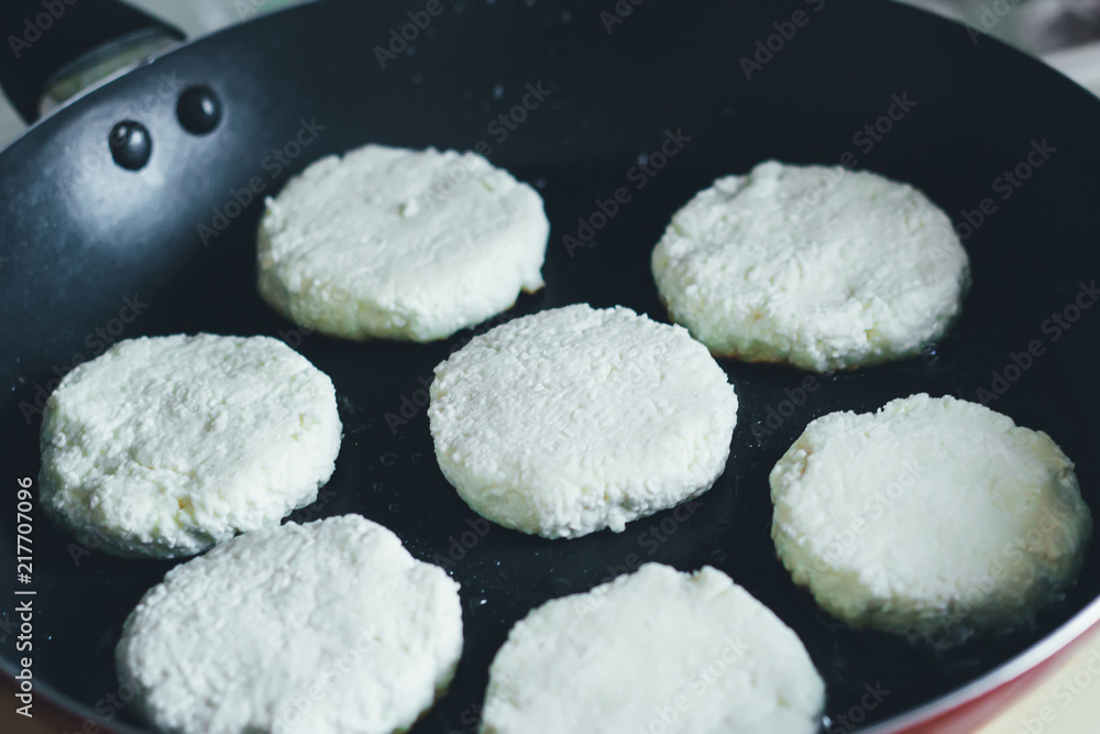Process of making cheese cakes in a frying pan Process of making cheese cakes in a frying pan