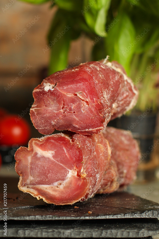 Fototapeta premium salami, sliced ​​slices (sausages) . food background. &nbsp;Top view with copy space