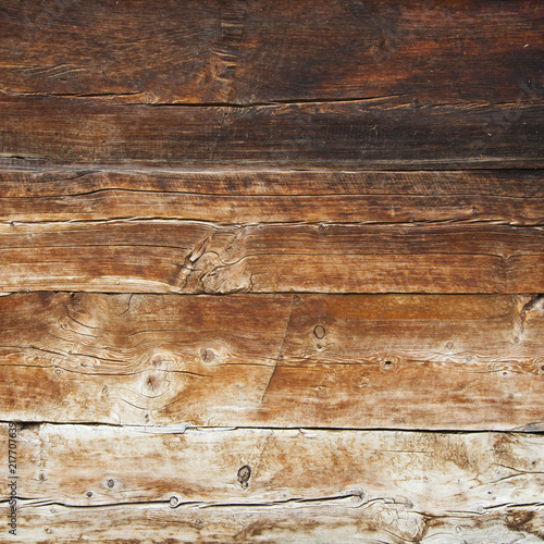 closeup of very old brown wooden weathered planks of door or barn