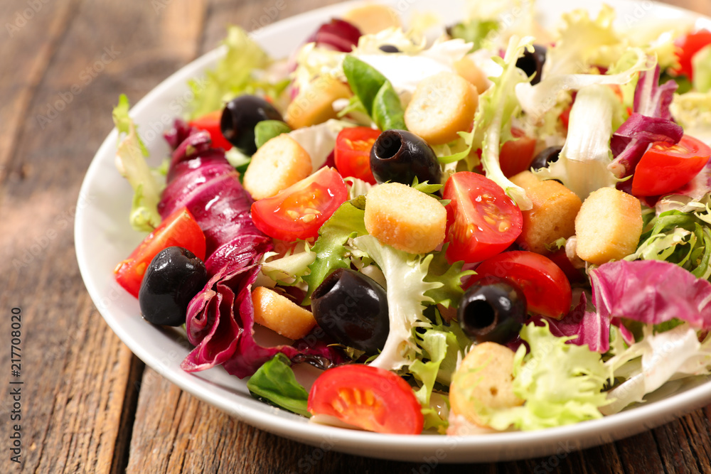 vegetable salad on wood background