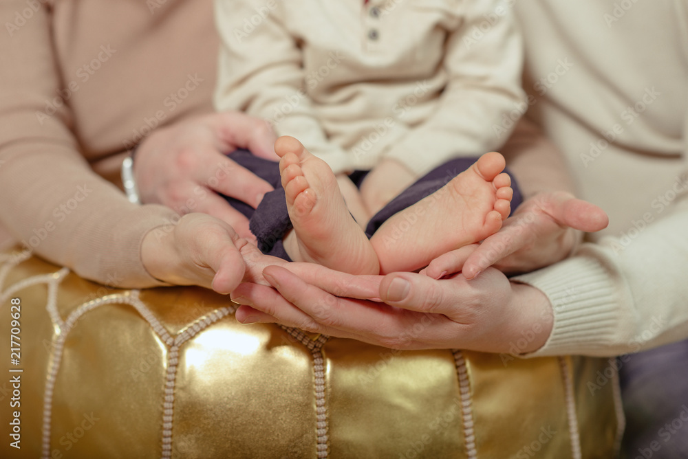 Feet of new born Baby in Hands of parents Feet of new born Baby in Hands of parents