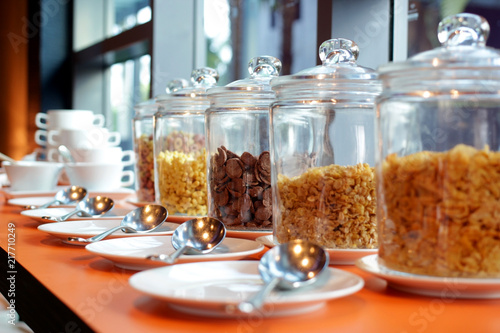 Obraz na płótnie cereal cornflakes in a glass jar on buffet table