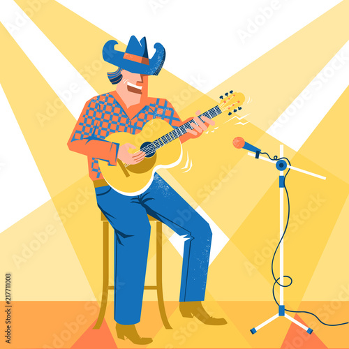 Musician singer man in cowboy hat palying the guitar. Music festival concert