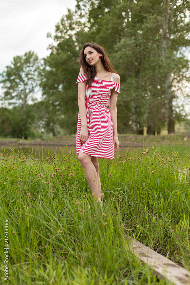 Portrait of a beautiful girl in the summer in the forest Portrait of a beautiful girl in the summer in the forest
