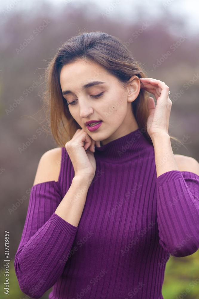 Girl in lilac dress on nature in autumn, Portrait of a beautiful girl in the autumn in the forest Girl in lilac dress on nature in autumn, Portrait of a beautiful girl in the autumn in the forest