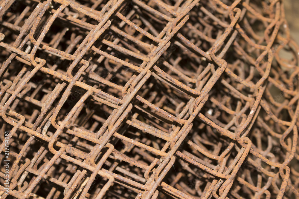 An old rusty wire mesh fence An old rusty wire mesh fence
