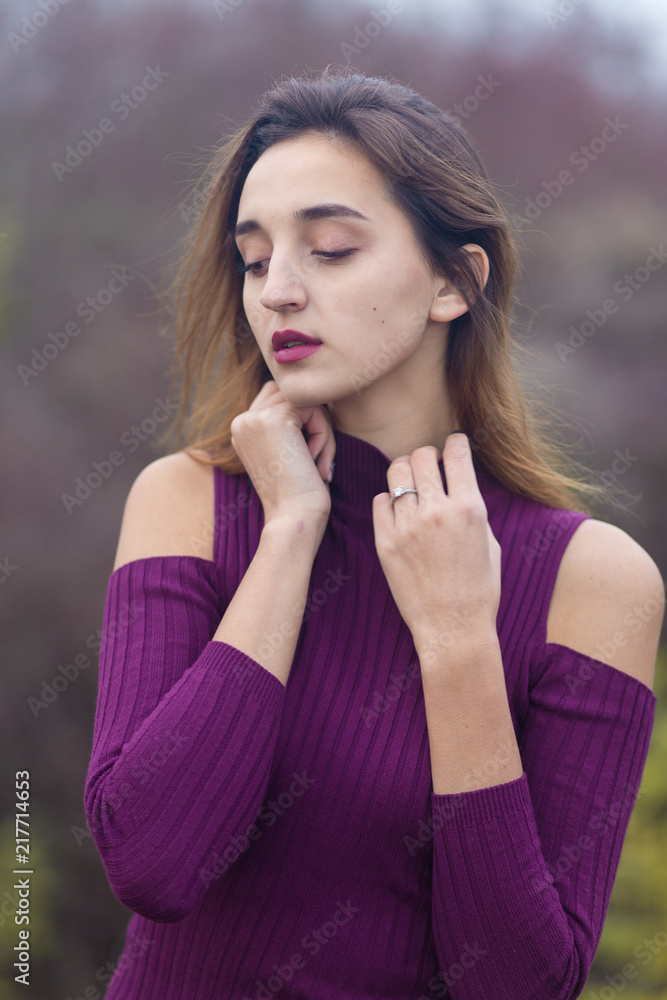 Girl in lilac dress on nature in autumn, Portrait of a beautiful girl in the autumn in the forest	