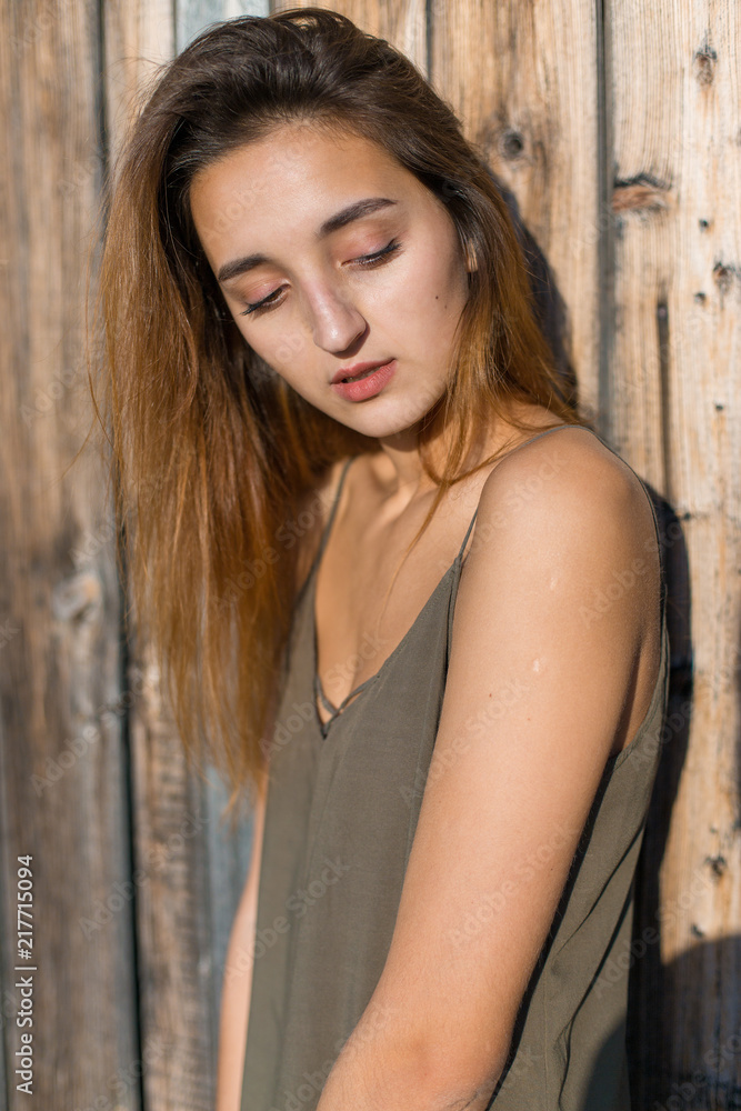 Girl in a light dress on the straps, sexy grunge girl sensually Girl in a light dress on the straps, sexy grunge girl sensually