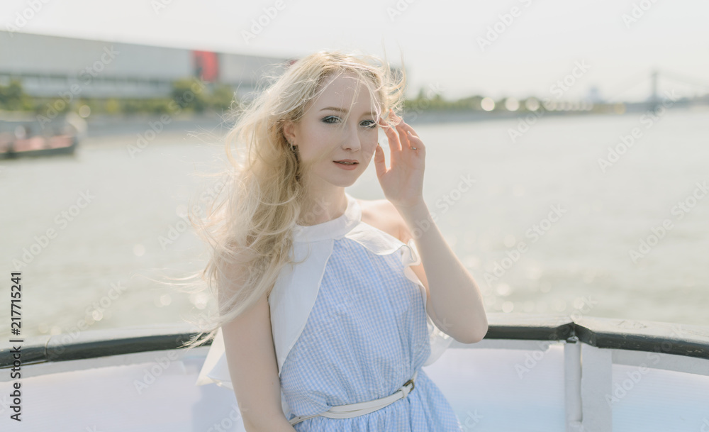 Young woman enjoy a boat tour through river.