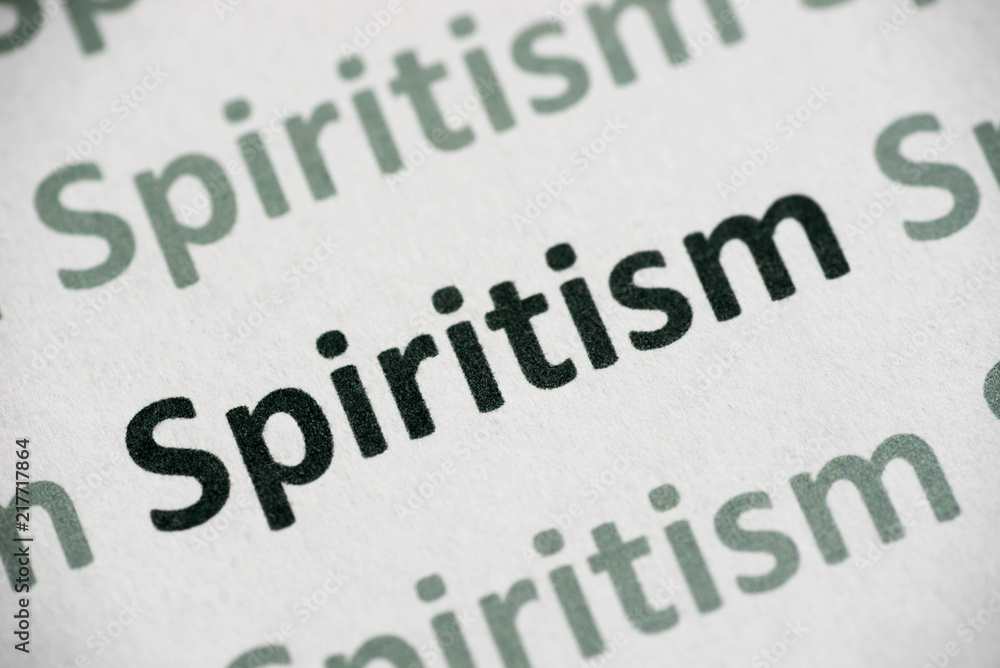 word Spiritism printed on paper macro
