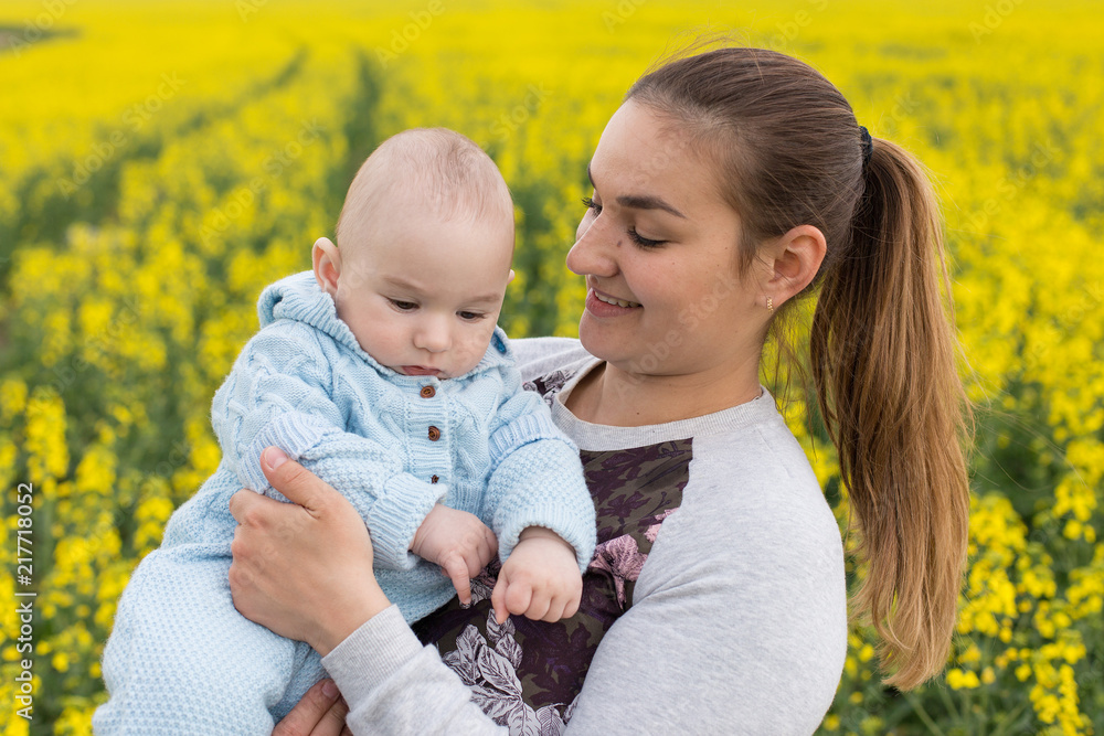 Happy mother with the child in the field Happy mother with the child in the field