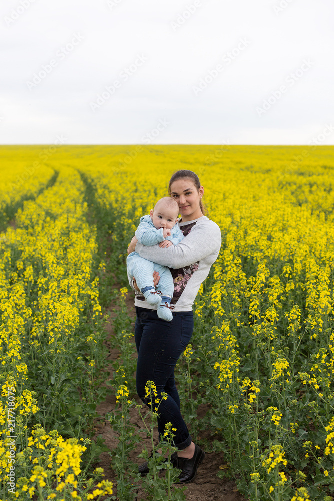 Happy mother with the child in the field Happy mother with the child in the field
