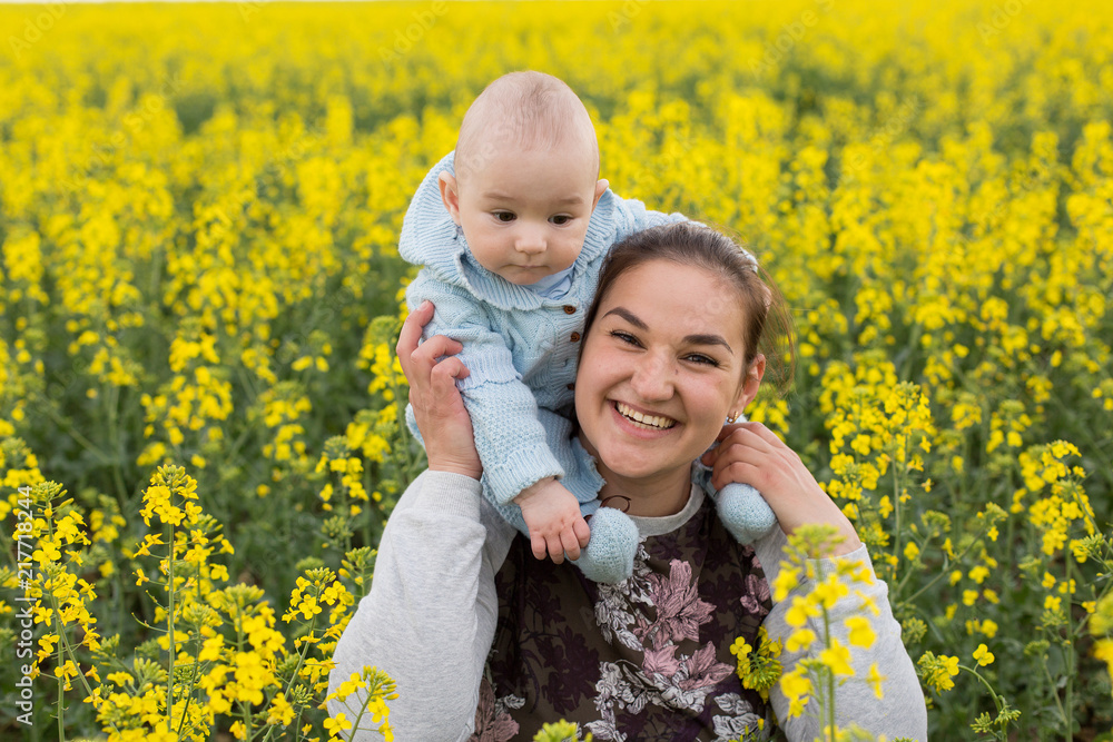 Happy mother with the child in the field Happy mother with the child in the field